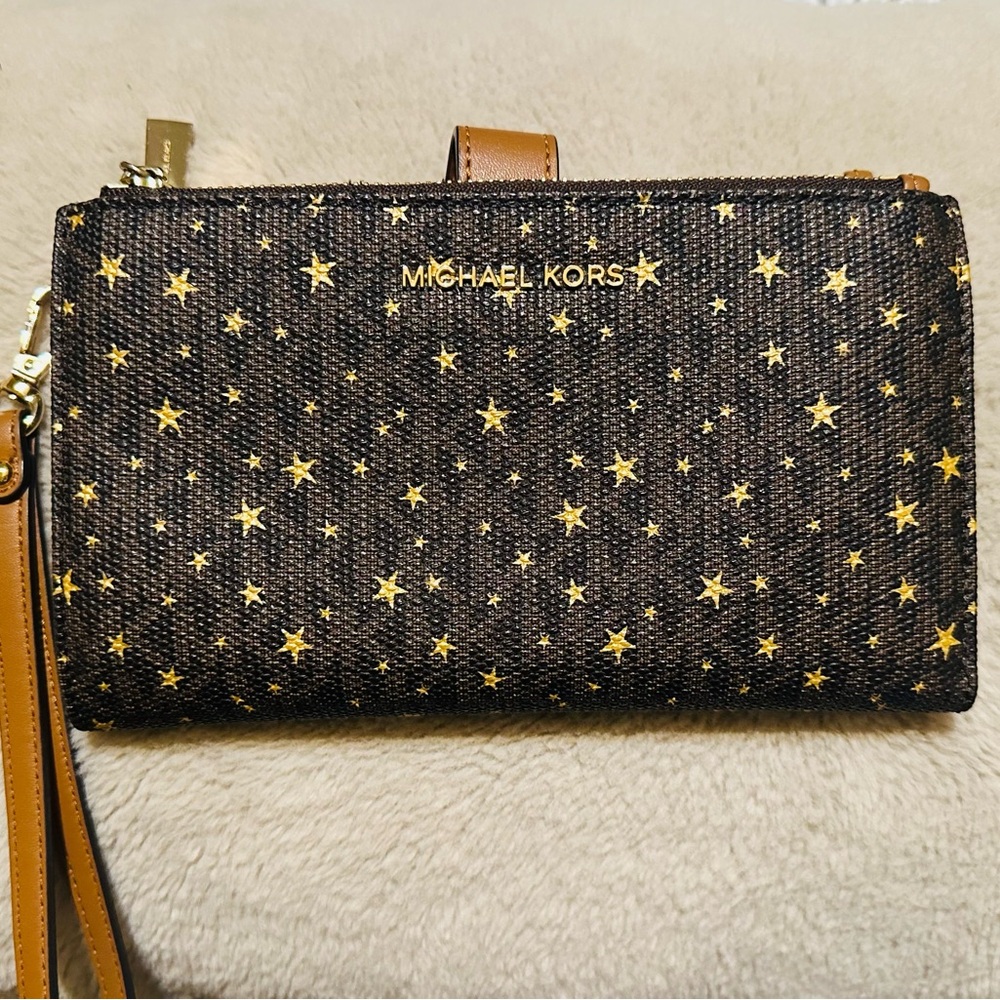 “Michael Kors Wallet”
Carry your phone in style with this chic accessory.